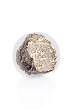 Black truffle section isolated on white
