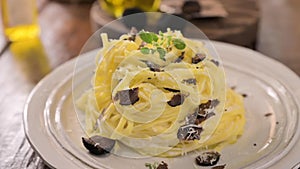 Black truffle on tagliatelle pasta. Expensive lunch, homemade pasta, traditional in the Lazo region of Italy.