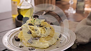 Black truffle on tagliatelle pasta. Expensive lunch, homemade pasta, traditional in the Lazo region of Italy.