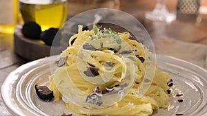 Black truffle on tagliatelle pasta. Expensive lunch, homemade pasta, traditional in the Lazo region of Italy.