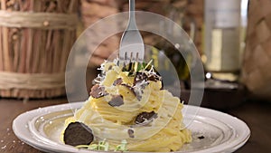 Black truffle on tagliatelle pasta. Expensive lunch, homemade pasta, traditional in the Lazo region of Italy.