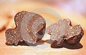 black truffles on a chopping board