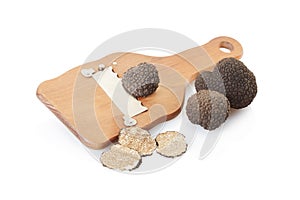 Black truffles, slices and wooden truffle slicer photo