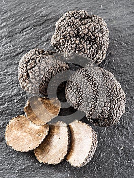 Black truffles and truffle slices.