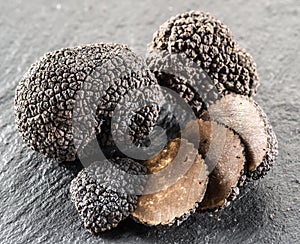 Black truffles and truffle slices. photo