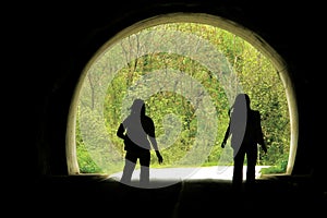 Black tunnel and people