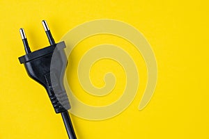 Black type C electric plug connector on yellow background with c