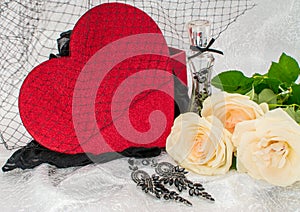 Black underwear knickers in gliter red box heart shaped perfume white roses juwelery  on white background