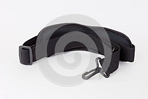 Black universal shoulder belt on white photo