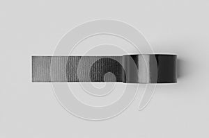 Black unrolled duct tape mockup on a grey background