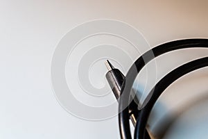 Usb cable plug, black connector wire closeup