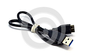 Black USB cable on white background