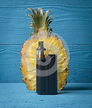 Black vaporizer and pineapple