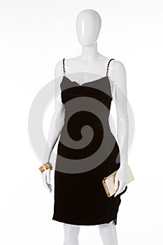 Black velvet dress on white mannequin.