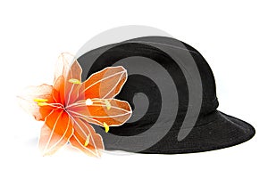 Black velvet hat with orange flower