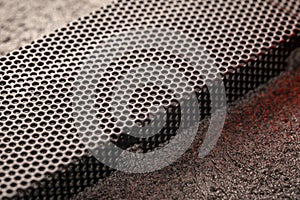 Black ventilation holes of a metal computer case