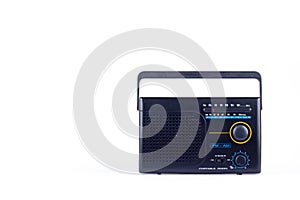 Black vintage retro style AM, FM portable radio transistor receiver on white background isolated