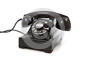 A black retro rotary phone on a white background photo