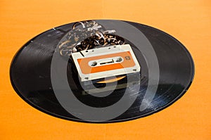 Black vinyl record on colored background photo
