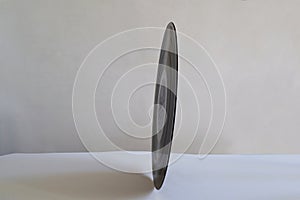 Black vinyl record on edge