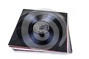 Black vinyl record on the white background.