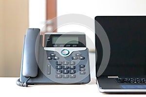 Black voip telephone on desk photo
