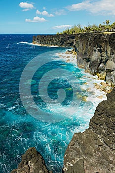 Black volcanic lava sea coast at Reunion island, France.