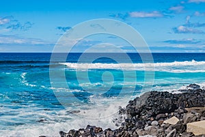 Black and volcanic rocks, sea and sky blue gradient at Santa BÃ¡rbara beach, SÃ£o Miguel - Azores PORTUGAL photo