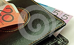 Black wallet and bank notes