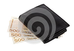 Black wallet on top Norwegian currency