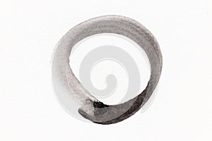 Black watercolor handdrawing as brush or banner in circle or round shape on white paper background