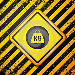 Black Weight icon isolated on yellow background. Kilogram weight block for weight lifting and scale. Mass symbol