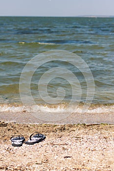 Black and Whiet Sandals on the beach