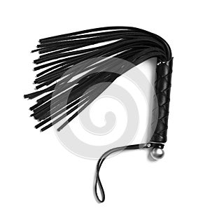 Black whip for sexual role play on white background photo