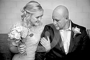 Black and Whirte image of close up of bride and groom in vintage clothing