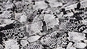 Black and white abstract camouflage. The concealment pattern on a fabric. photo