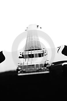 Black and white abstract silhouette of a guitar on a white background.