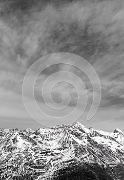 Black-and-white Alpine landscape and snow-capped peaks. Lots of mountains