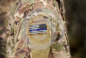 Black and white American flag with thin blue line on military uniform. Thin blue line flag. Thin blue line flag law enforcement photo