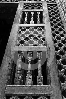 Angle view of wooden carved decorations of interleaved wooden door - Mashrabiya photo