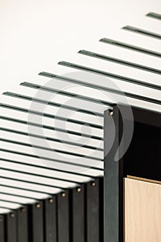 Black and white architectural detail featuring wooden frames on the ceiling in an office setting