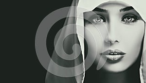 Black and white artistic closeup portrait of beautiful serious woman photo