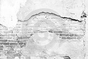 Black and white background concept, Old white masonry is cracking and decaying. The abstract white interior of an old broken brick