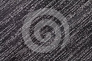 Black and white background of a knitted textile material. Fabric with a striped texture closeup.