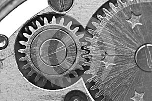 Black white background with metal gear wheels of the old clockwork. Conceptual photo for successful business design. Macro