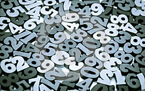 Black and white background of wooden numbers from zero to nine