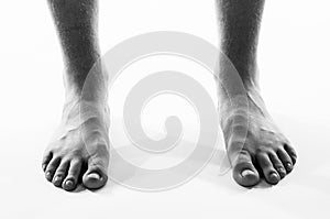 Black and white barefoot male feet