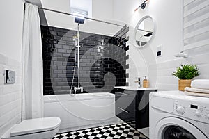Black and white bathroom with bathtub