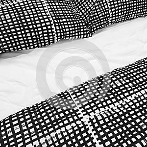 Black and white bed linen with pillows