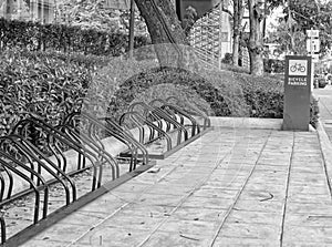 black and white bicycle parking in the center of the city, ecological mobility photo
